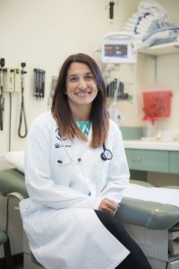 Dr. Natasha Kekre in a patient examination room.