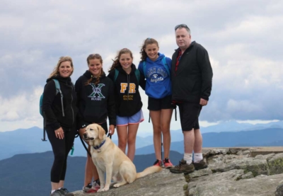 Ian McDonell with his wife Michelle (left), and their daughters Kendra, Macy, and Ainsley, hiking in the Adirondack Mountains in 2019.