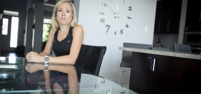 Karen Lawrence sitting at the kitchen table in her home.