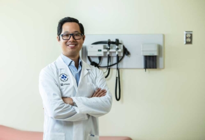 Oncologist Dr. Michael Ong posing with armed crossed at The Ottawa Hospital.