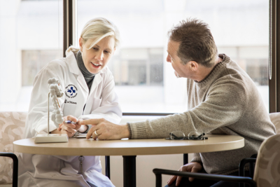 Doctor speaking with a patient in her office at a hospital