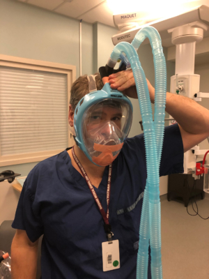 Dr. Neilipovitz trying on a prototype mask