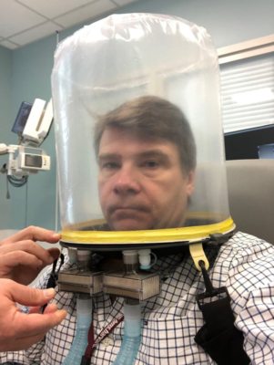 Dr. David Neilipovitz with an oxygen hood