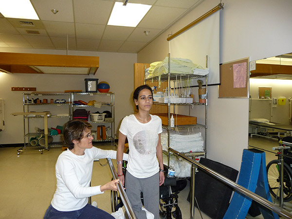 Bushra at the Rehab Centre, learning to stand.
