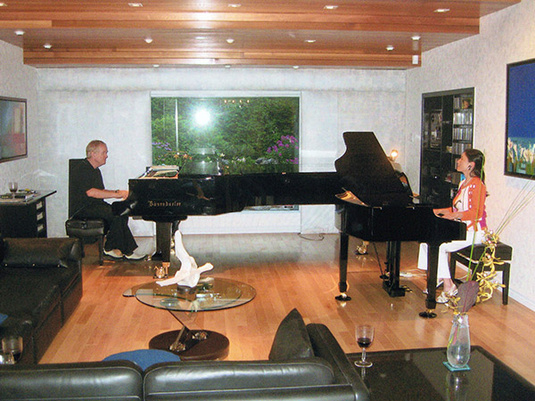 Ida and Clarence playing piano