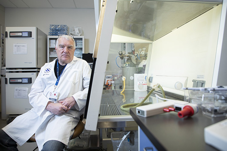 Dr. John Bell in lab