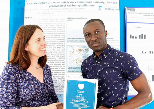 Meshach receiving the Gold Certificate from Dr. Judith Ramage at The University of Nottingham, UK (2014).