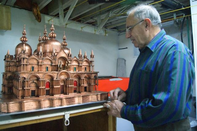 An image of Vittorio Petrin with a replica of St. Mark’s Basilica he built while losing his vision to retinitis pigmentosa.