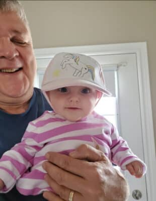 Mike Soloski with his grandchild