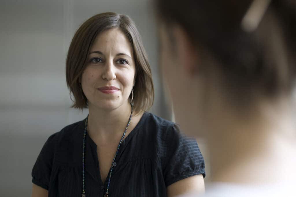 Heather Mc Kenna, a social worker at The Ottawa Hospital, speaks with a patient